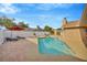 Backyard swimming pool and lounge area with a red umbrella offering a perfect outdoor space for relaxing and entertaining at 1410 Monte Lake Dr, Valrico, FL 33596
