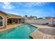 Outdoor pool and lounge area with patio umbrella and lounge chairs providing a perfect spot for relaxation at 1410 Monte Lake Dr, Valrico, FL 33596
