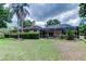 Sprawling backyard and screened pool area surrounded by lush landscaping at 15302 Lake Maurine Dr, Odessa, FL 33556