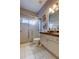 Bathroom with a tiled shower, modern vanity, and neutral decor that creates a relaxing atmosphere at 15302 Lake Maurine Dr, Odessa, FL 33556
