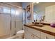 Bathroom with a tiled shower, modern vanity, and neutral decor that creates a relaxing atmosphere at 15302 Lake Maurine Dr, Odessa, FL 33556