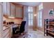 Well-lit home office with custom built-ins, a spacious desk, and neutral colors at 15302 Lake Maurine Dr, Odessa, FL 33556