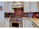 Modern kitchen with stainless steel appliances, granite countertops, and custom cabinetry at 15302 Lake Maurine Dr, Odessa, FL 33556