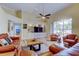 Bright and airy living room with hardwood floors, built-in shelving, and ample seating at 15302 Lake Maurine Dr, Odessa, FL 33556