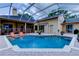 Backyard swimming pool is screened with brick pavers and is great for entertaining at 15302 Lake Maurine Dr, Odessa, FL 33556
