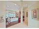 Spacious living room with wood flooring, fireplace, built-in shelves, and access to the screened lanai at 16343 Burniston Dr, Tampa, FL 33647