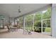 Large screened porch with an outdoor kitchen and view of the backyard, perfect for enjoying the outdoors at 16343 Burniston Dr, Tampa, FL 33647