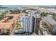 A beautiful aerial view of a modern apartment building with a rooftop pool and landscaped recreation area at 199 Dali Blvd # 403, St Petersburg, FL 33701