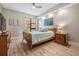Comfortable bedroom with ceiling fan, natural light and wood-look flooring at 199 Dali Blvd # 403, St Petersburg, FL 33701