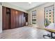 Modern bedroom with built-in storage and stylish tile flooring bathed in natural light from large windows at 199 Dali Blvd # 403, St Petersburg, FL 33701