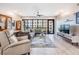 Bright, spacious living room with a wall of windows and open design for flexible living arrangements at 199 Dali Blvd # 403, St Petersburg, FL 33701