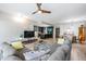 Open living space featuring a modern kitchen, dining area, and comfortable living room with sleek finishes at 199 Dali Blvd # 403, St Petersburg, FL 33701