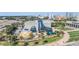 Unique glass building exterior surrounded by tropical landscape, city skyline in background at 199 Dali Blvd # 403, St Petersburg, FL 33701