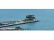 Scenic waterfront view of a modern pier, featuring palm trees and blue water at 199 Dali Blvd # 403, St Petersburg, FL 33701