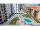 Aerial view of outdoor amenities including the pool, lounge areas, and community green spaces at 199 Dali Blvd # 403, St Petersburg, FL 33701