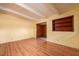 Bright living room with laminated wood flooring and a built-in display shelf at 2003 Waikiki Way, Tampa, FL 33619