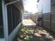 Fenced backyard featuring a grill and a screened porch at 212 Driftwood Pl, Palm Harbor, FL 34683