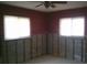 Bedroom featuring natural light through two windows at 212 Driftwood Pl, Palm Harbor, FL 34683