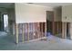 Living room showing stud framing and partial wall, showcasing potential for customization and design at 212 Driftwood Pl, Palm Harbor, FL 34683