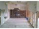 Interior view of stud framing, showcasing the room's layout and potential for customization and design at 212 Driftwood Pl, Palm Harbor, FL 34683