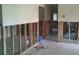 Interior view of stud framing, showcasing the room's structure and potential for design modifications at 212 Driftwood Pl, Palm Harbor, FL 34683