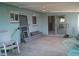 Covered patio with view to main house at 212 Driftwood Pl, Palm Harbor, FL 34683