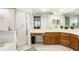 Large Primary bathroom features a stand-up shower, vanity with under-cabinet storage, and large mirror at 2222 Longmore Cir, Valrico, FL 33596