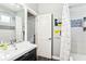 Bathroom with modern vanity, framed mirror, mosaic tile accents, and shower with curtain at 2222 Longmore Cir, Valrico, FL 33596