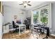 Bright bedroom featuring a ceiling fan, large window, and a desk set up with computer and electronic drum set at 2222 Longmore Cir, Valrico, FL 33596