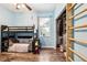 Bedroom featuring a bunk bed, window, closet, and modern decor at 2222 Longmore Cir, Valrico, FL 33596