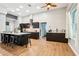 Modern kitchen featuring black cabinets, a large island with seating, and stainless steel appliances at 2222 Longmore Cir, Valrico, FL 33596