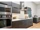 Close up view of the modern kitchen with stainless steel appliances and granite countertops at 2222 Longmore Cir, Valrico, FL 33596