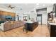Open concept kitchen and living room area, island with seating, and modern design at 2222 Longmore Cir, Valrico, FL 33596