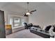 Bright bedroom with a window bench, ceiling fan and space for a desk and bed at 2413 Buckhorn Run Dr, Valrico, FL 33596