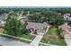 Aerial view of house showing the roof, driveway, mature landscaping and the surrounding neighborhood at 2413 Buckhorn Run Dr, Valrico, FL 33596