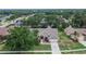 Aerial view of a well-maintained home with a manicured lawn and mature trees at 2413 Buckhorn Run Dr, Valrico, FL 33596