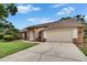 Beautiful home with a spacious driveway and lush green lawn at 2413 Buckhorn Run Dr, Valrico, FL 33596
