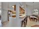 Open layout showcasing the kitchen with a breakfast bar and a dining room with vaulted ceilings at 2413 Buckhorn Run Dr, Valrico, FL 33596