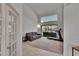 Bright living room with vaulted ceilings, neutral carpet, and a view of the lanai at 2413 Buckhorn Run Dr, Valrico, FL 33596