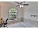 Bright office with natural light, a ceiling fan, and trimwork at 2413 Buckhorn Run Dr, Valrico, FL 33596