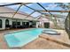 Enjoy the spacious pool, spa and patio enclosed in a screened area adjacent to ample outdoor living space at 2413 Buckhorn Run Dr, Valrico, FL 33596
