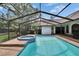 Screened-in pool with attached spa and tile accents offers a refreshing outdoor oasis at 2413 Buckhorn Run Dr, Valrico, FL 33596
