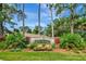 The Reserve community entrance sign surrounded by lush landscaping and tall trees against a blue sky at 2823 Banyan Hill Ln, Land O Lakes, FL 34639
