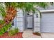 Charming front entrance with a well-maintained landscaped yard at 2823 Banyan Hill Ln, Land O Lakes, FL 34639