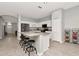 Bright, open kitchen features a spacious island with seating, stainless appliances, and ample storage at 2823 Banyan Hill Ln, Land O Lakes, FL 34639