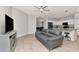 Open-concept space connecting the living room and kitchen for seamless entertaining at 2823 Banyan Hill Ln, Land O Lakes, FL 34639