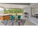 Relaxing screened porch offering a tranquil outdoor space with a view of the surrounding landscape at 2823 Banyan Hill Ln, Land O Lakes, FL 34639