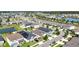 Aerial view of a residential neighborhood with homes, ponds, and well-maintained landscaping at 34266 Radley Way, Wesley Chapel, FL 33545