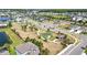 Beautiful aerial view of a community featuring a park, playground, and basketball court at 34266 Radley Way, Wesley Chapel, FL 33545
