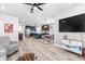 Open-concept living space seamlessly connects the kitchen, dining, and living areas creating an inviting atmosphere at 34266 Radley Way, Wesley Chapel, FL 33545